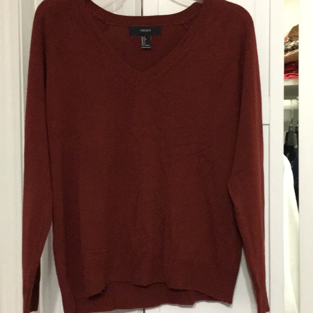 Dark, rust colored v neck sweater